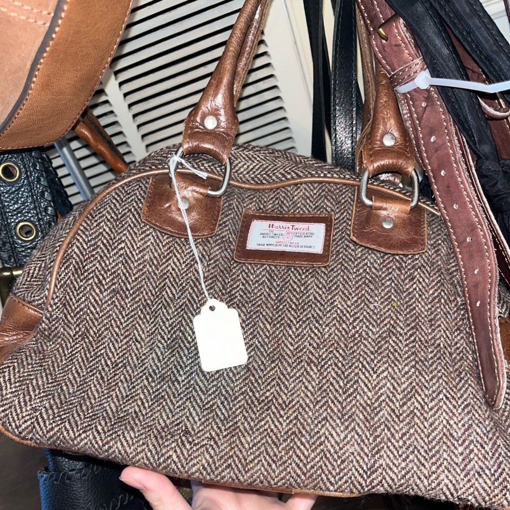 Harris Tweed brown with small brown straps. Zipper close
